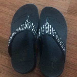 Navy blue FitFlop sandals with silver studs